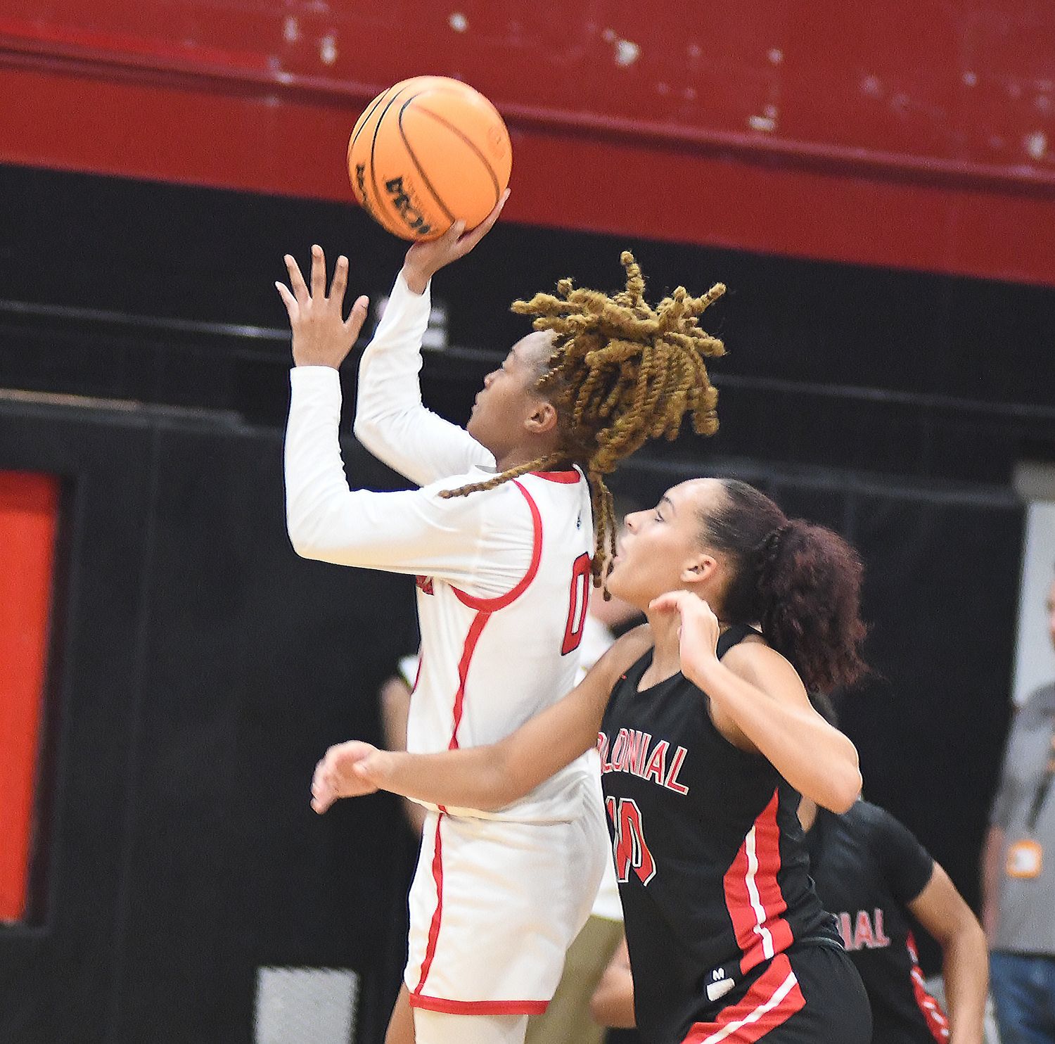 Lake Highland Prep's Jada Eads shoots over Colonial's Carmen Richardson during the second half of their nondistrict game. Eads had 22 points and eight rebounds in the Highlanders' 57-52 victory. Richardson had 16 points and six rebounds.